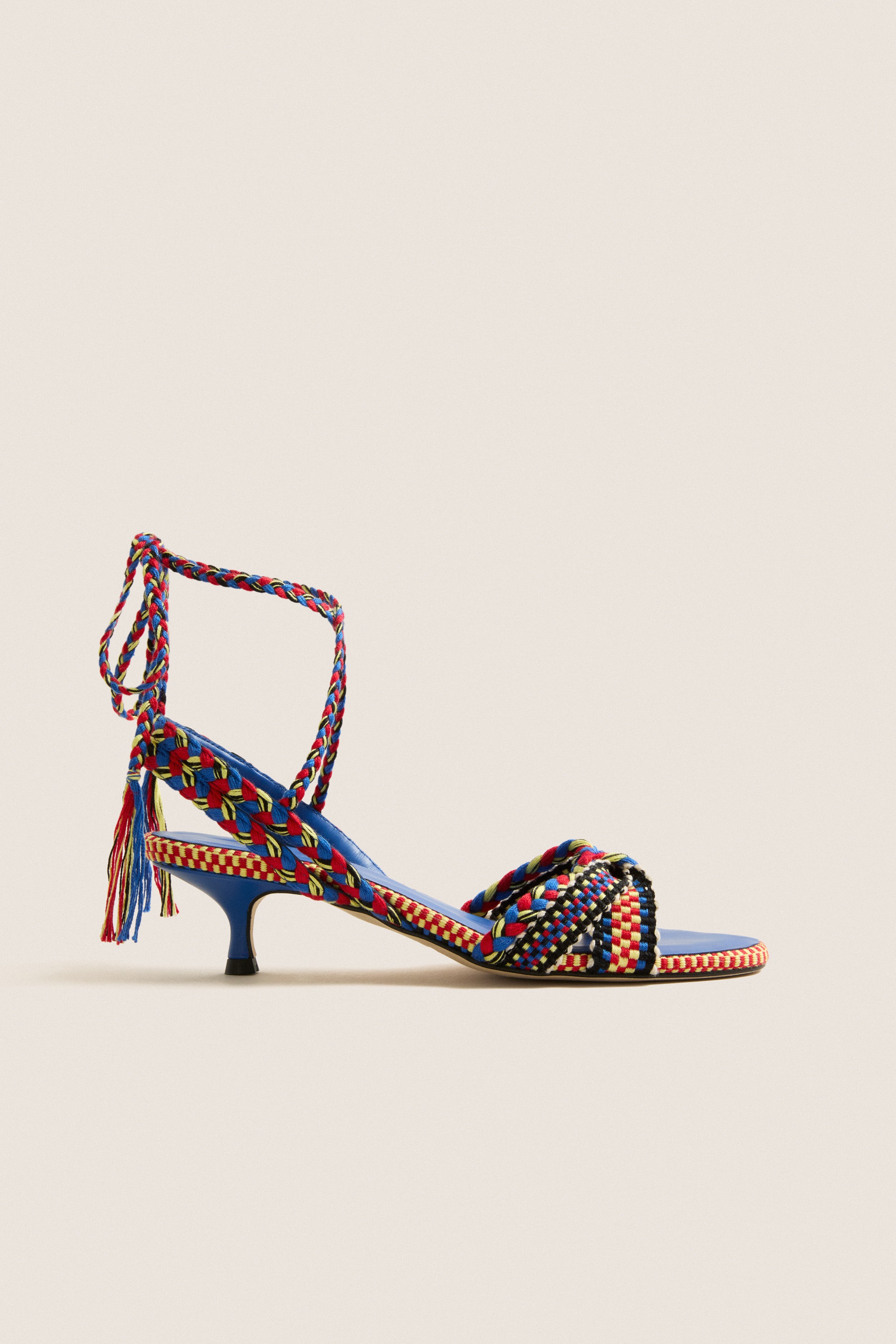 Miro Aitana Wrap Heels feature classic woven straps with a fun, effortless design and high-end tassel laces, perfect for confident, stylish adventures.