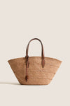 Nuez and Cognac Small Trapeze Basket, classic woven straw tote featuring effortless leather handles and tie, perfect for fun, high-end style with handwoven craftsmanship.