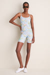 Model in classic Clubhouse Chintz Compression Spandex Mac Bike Shorts, showcasing an effortless, high-end athleisure look with matching camisole, white sneakers, and chic sunglasses.