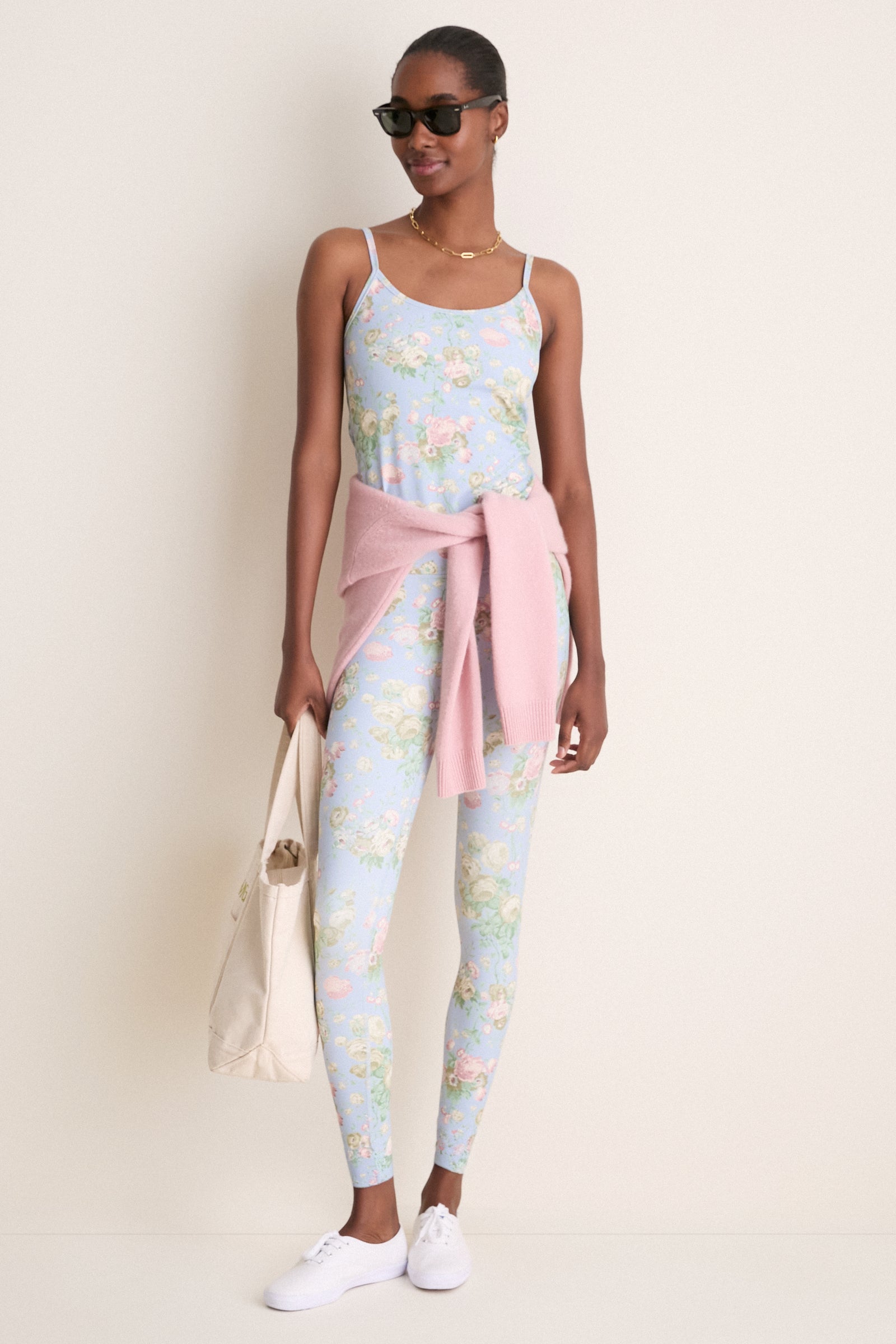 Person models Clubhouse Chintz High Rise Compression Spandex MacKenzie Legging, exhibiting classic, effortless style with a high-end floral print, perfect for fun, versatile wear.