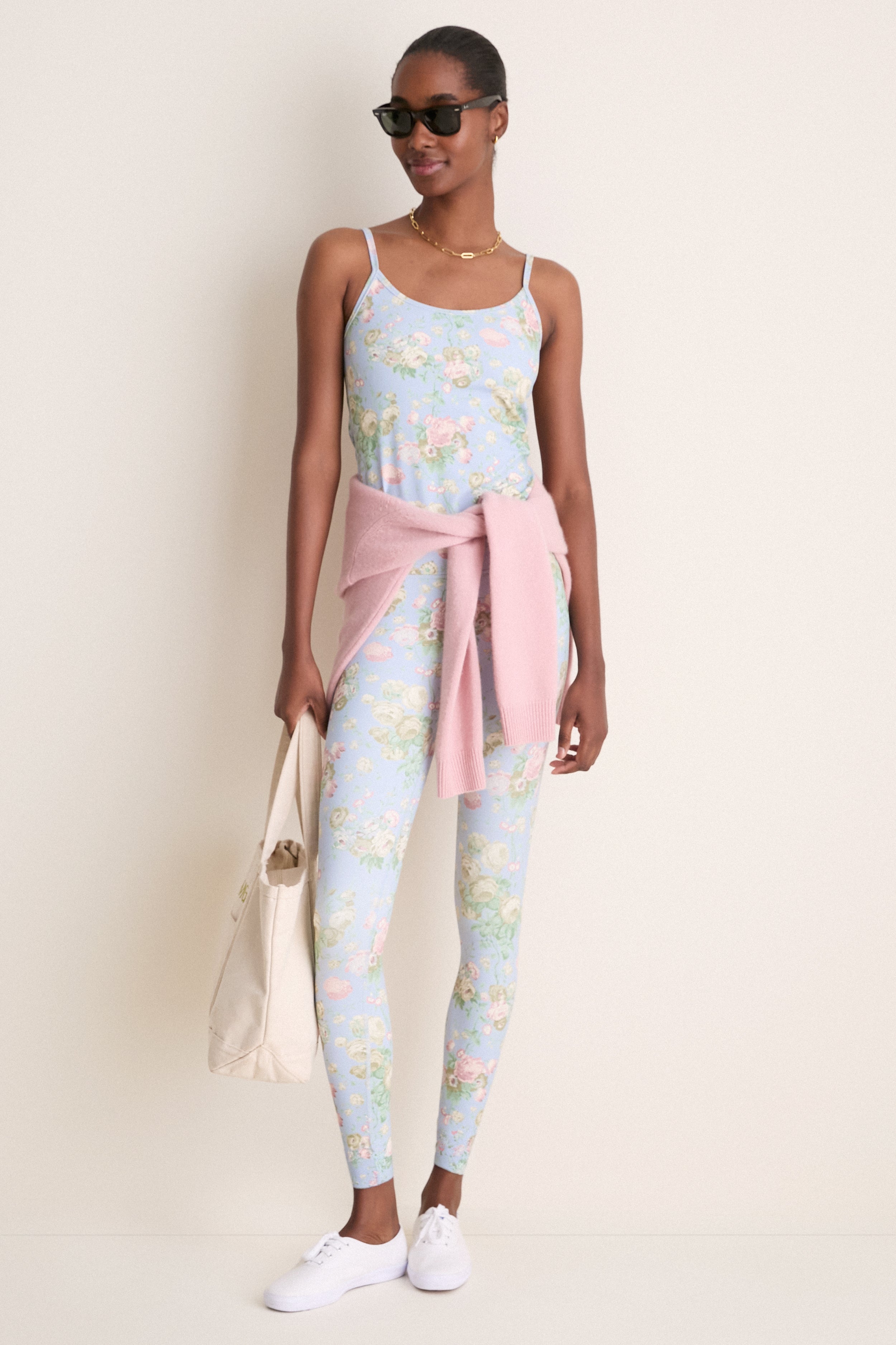 Person models Clubhouse Chintz High Rise Compression Spandex MacKenzie Legging, exhibiting classic, effortless style with a high-end floral print, perfect for fun, versatile wear.