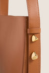 Classic Cognac Leather Nigeria Crossbody featuring elegant stitching and gold-tone hardware, exudes an effortless, high-end style, perfect for fun day-to-night transitions.