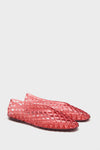 Classic Coral Jam Jellys: Effortless, fun flats featuring a translucent lattice design, perfect for a high-end, confident look.