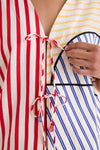 Navy Stripes Off-White Tie Front Blouse with contrasting stripes and beaded tassel ties; a classic, effortless piece bringing fun, high-end style to any wardrobe.