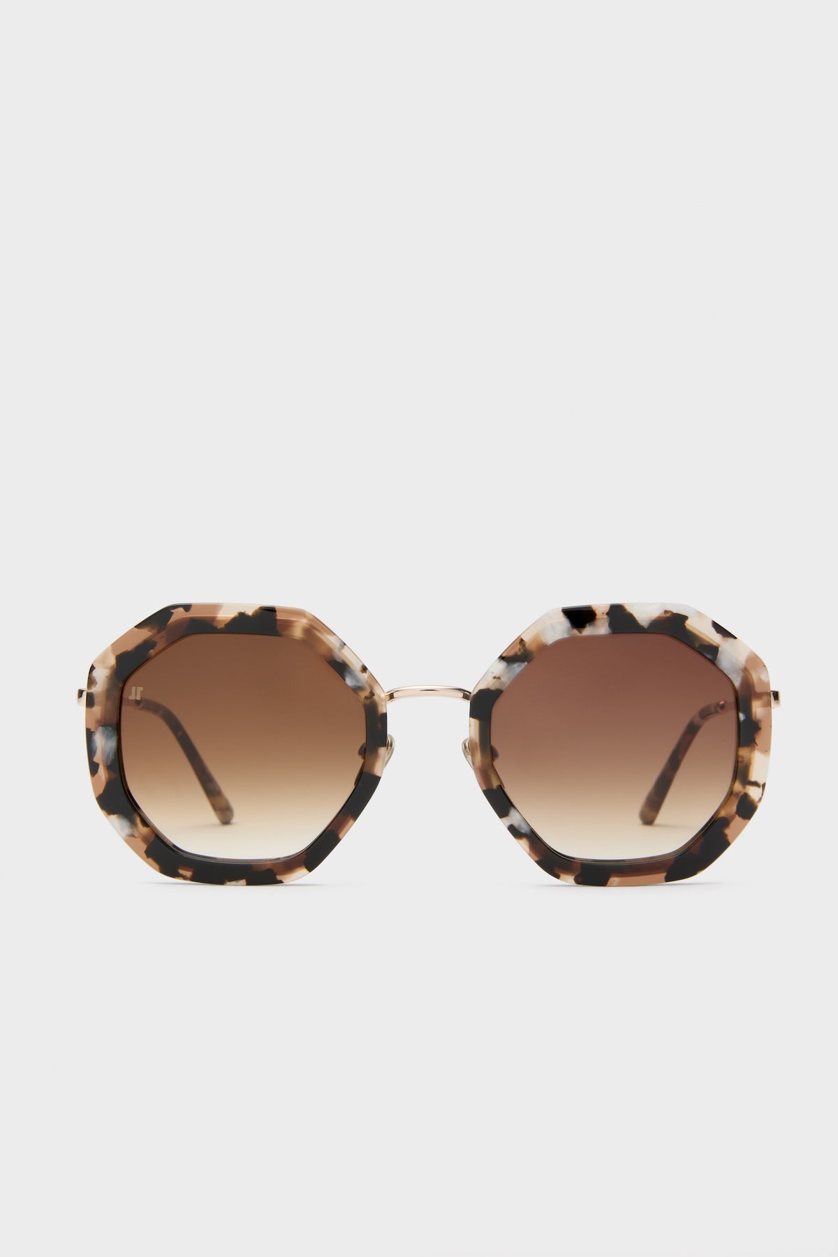 Brown Tortoise Angie Sunglasses feature oversized, octagonal frames with a classic tortoiseshell pattern and brown gradient lenses, offering an effortless, high-end accessory for any outfit.
