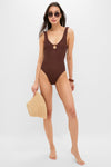 Model in a chocolate-brown swimsuit sports classic, oversized Brown Tortoise Angie Sunglasses, showcasing their effortless, high-end style with fun hexagonal frames.