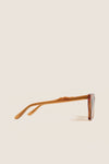 Cider Lisbon Sunglasses in translucent amber, featuring a classic cat-eye silhouette and three-barrel hinge, embodying effortless, high-end style for fun, everyday wear.