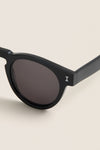 Black Leonard Sunglasses feature classic round lenses, glossy frames, and a chic “I” logo, merging effortless style with high-end craftsmanship for everyday fun and versatility.