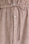 Close-up of Cafe Stripe Linen Julien Shirt Dress, showcasing its classic, high-end design with gathered waistband, button front, and effortless drawstring bow detail.