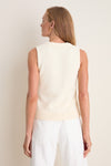 Woman wearing the classic Ivory Cotton Rope Mariner Tank, showcasing an effortless and high-end style with its braided neckline detail and ribbed hem.