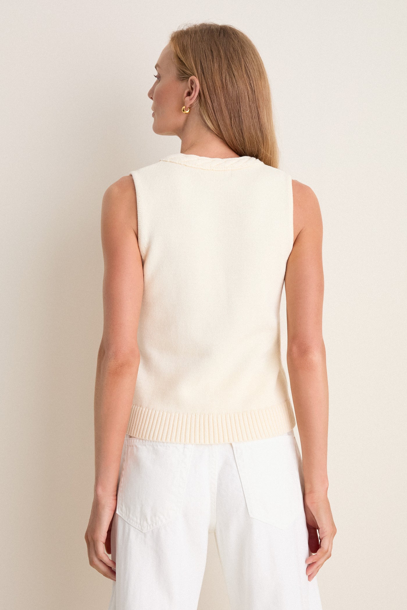 Woman wearing the classic Ivory Cotton Rope Mariner Tank, showcasing an effortless and high-end style with its braided neckline detail and ribbed hem.
