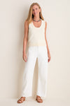 Model wearing the classic Ivory Cotton Rope Mariner Tank, paired with high-waisted pants and sandals, exuding an effortless, fun, and high-end style.