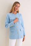 Light Blue Tweed Jennings Jacket: A classic, high-end tweed jacket with gold buttons and flap pockets, exuding effortless elegance, styled with white pants for a fun, professional look.