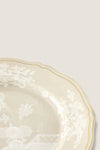 Oriente Italiano Meringa Dinner Plate, a classic porcelain piece with a gold-edged scalloped rim and intricate white floral design, embodies effortless elegance and high-end craftsmanship.