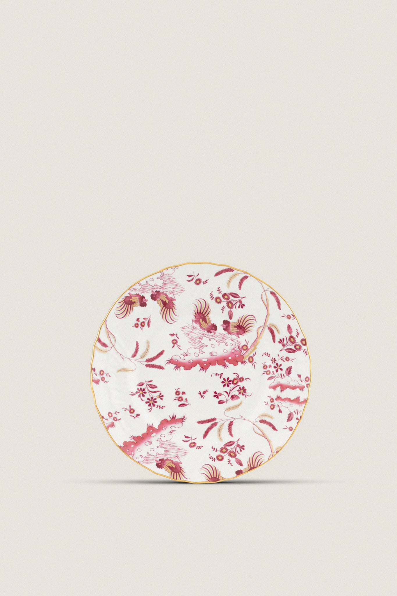 Oro Di Doccia Magenta Dinner Plate featuring classic floral and rooster motifs with gold trim, handcrafted in Italy for an effortless, high-end tablescape addition.