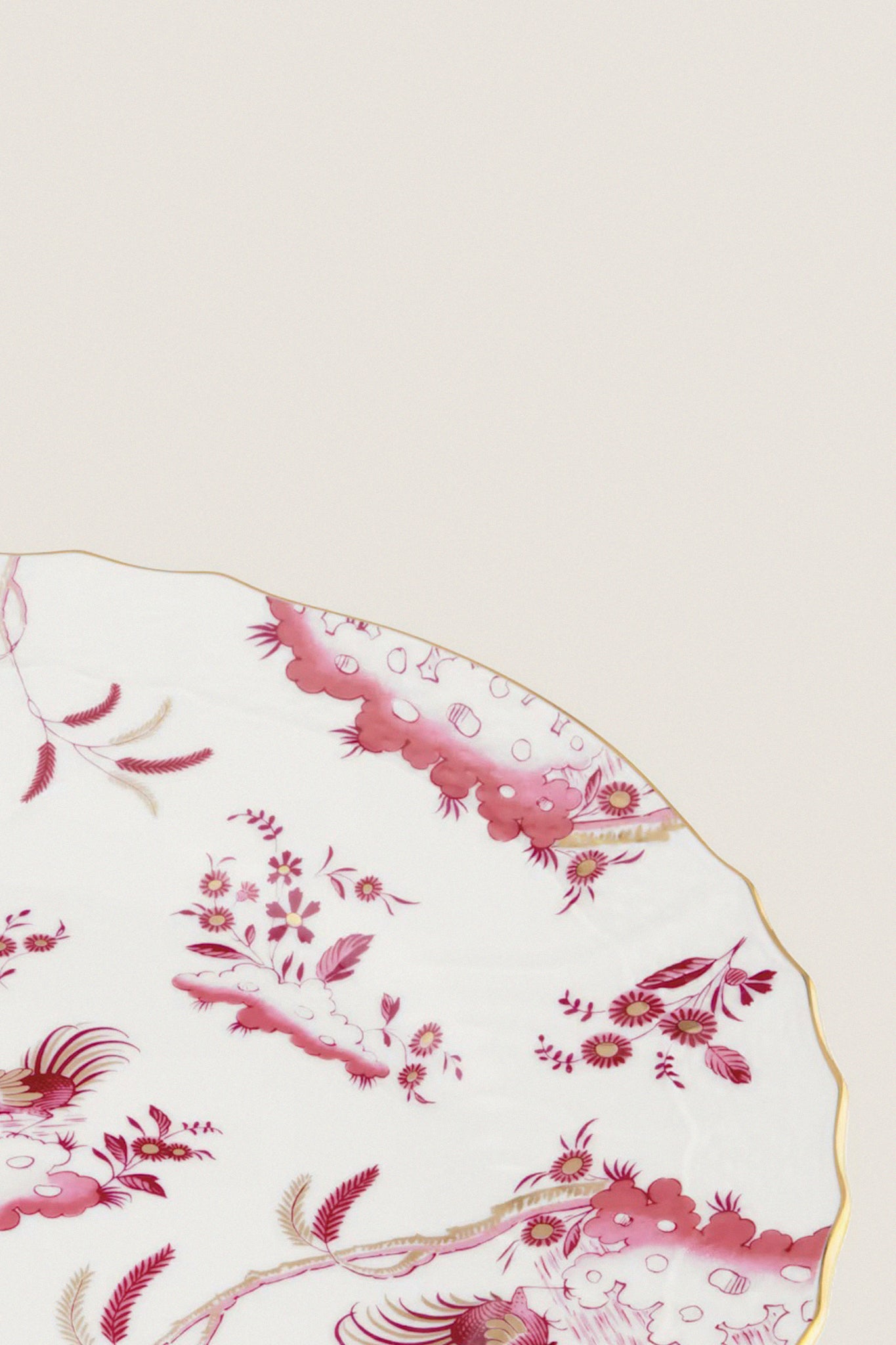 Oro Di Doccia Magenta Dinner Plate features a classic porcelain design with an effortless pink floral pattern, fun gold-trimmed edge, embodying high-end Italian craftsmanship.