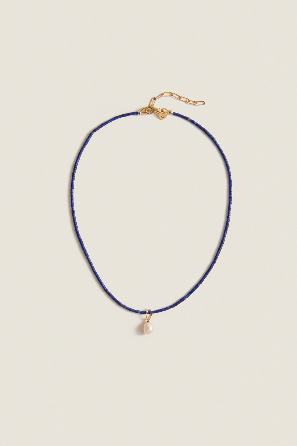 Lapis Lazuli Teeny Gemstone Necklace with Cloud Pearl Charm, featuring a classic, effortless design with high-end detailing, including an adjustable clasp and a fun, removable pearl pendant.
