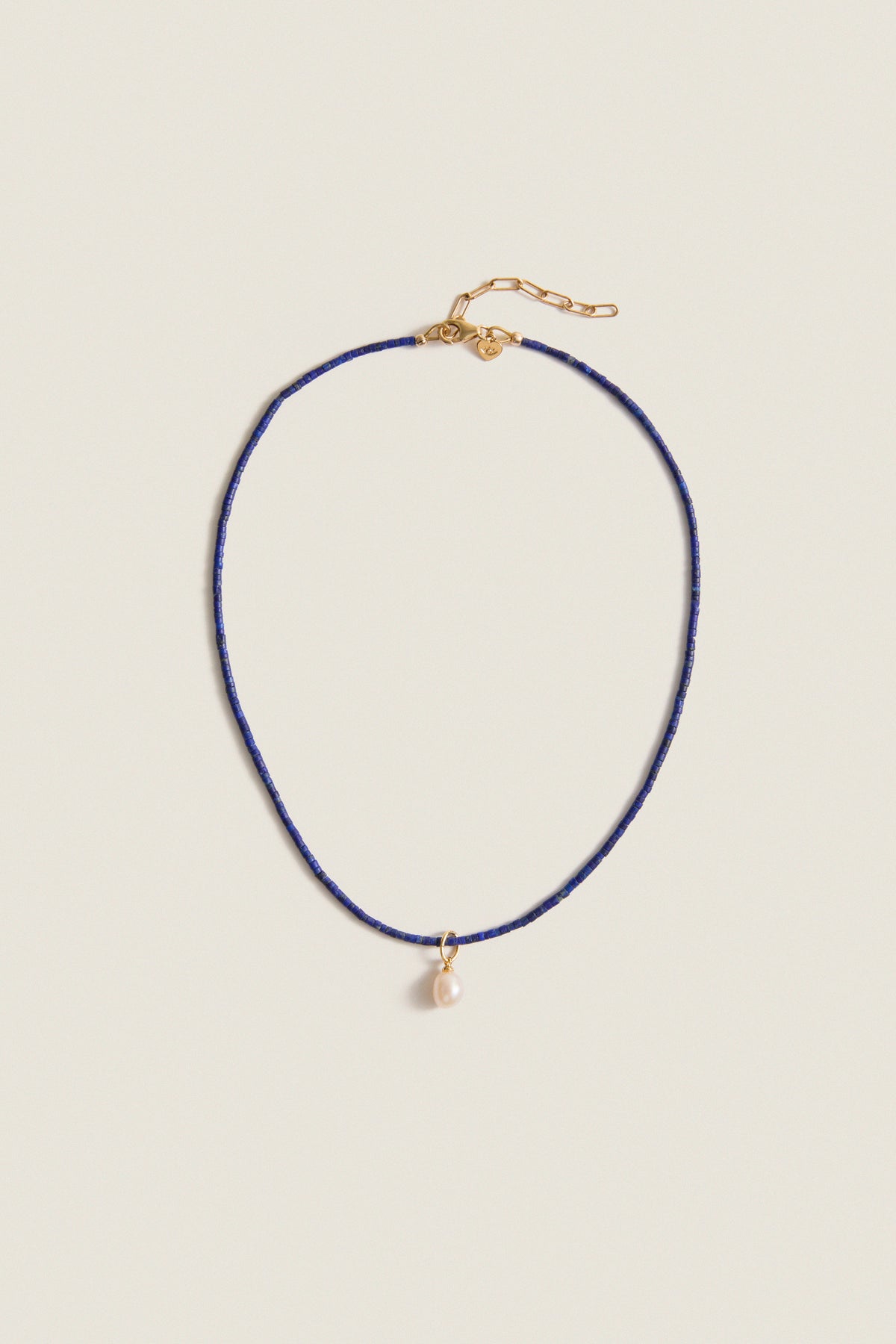 Lapis Lazuli Teeny Gemstone Necklace with Cloud Pearl Charm, featuring a classic, effortless design with high-end detailing, including an adjustable clasp and a fun, removable pearl pendant.