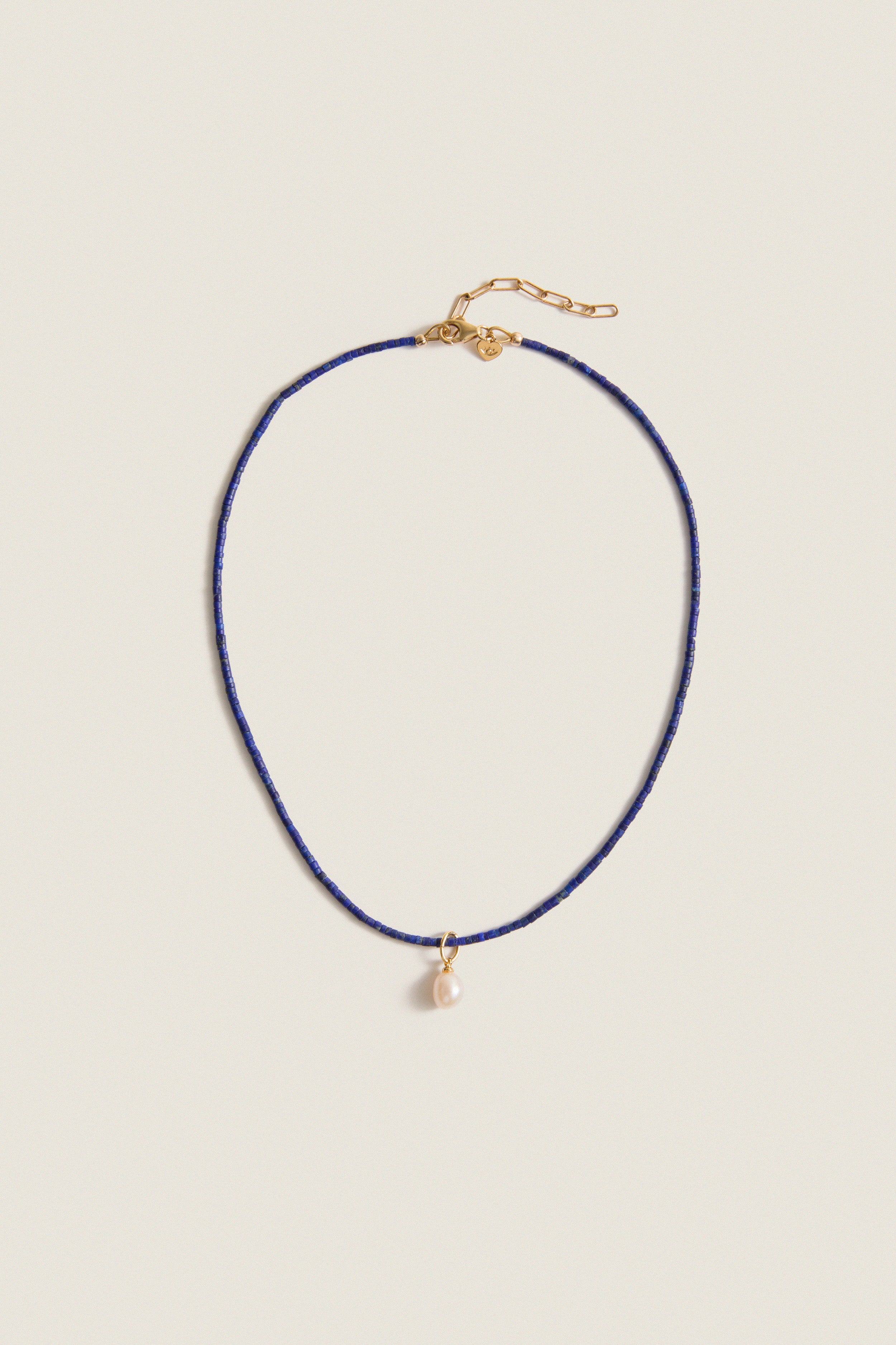 Lapis Lazuli Teeny Gemstone Necklace with Cloud Pearl Charm, featuring a classic, effortless design with high-end detailing, including an adjustable clasp and a fun, removable pearl pendant.