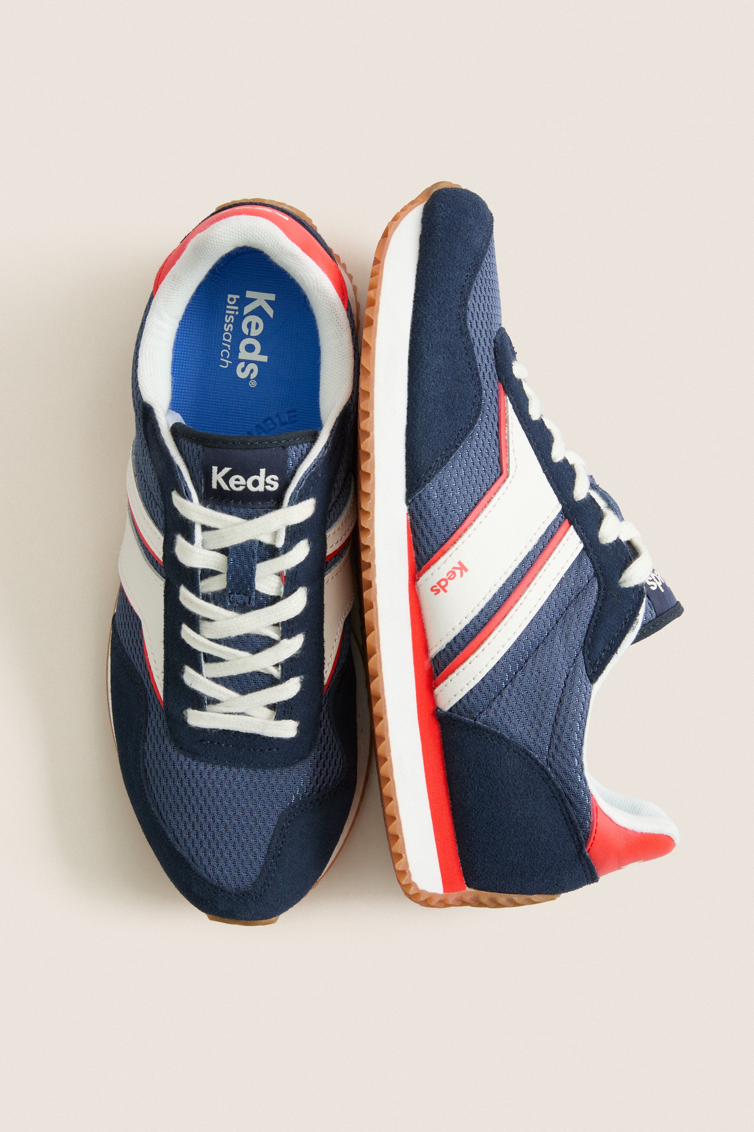 Classic Navy, Red and White Rena Sneakers with mesh panels, suede overlays, and gum-rubber outsole, offering an effortless, high-end style for fun, confident adventures.