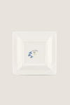 Oriente Italiano Iris Large Square Change Tray: A classic porcelain plate with blue floral motifs and gold trim, offering effortless elegance and high-end artistic craftsmanship.