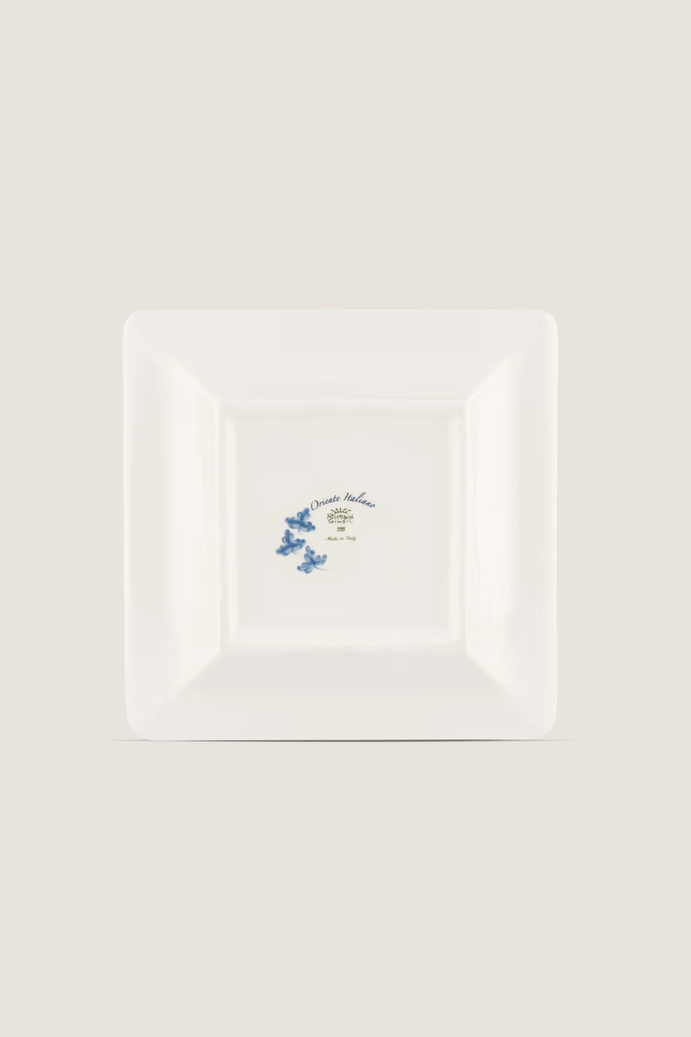 Oriente Italiano Iris Large Square Change Tray: A classic porcelain plate with blue floral motifs and gold trim, offering effortless elegance and high-end artistic craftsmanship.