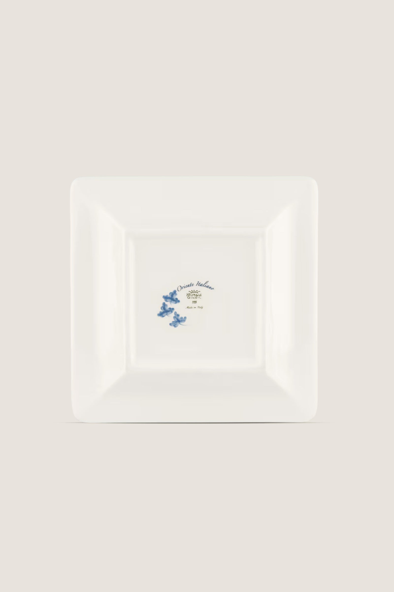 Oriente Italiano Iris Large Square Change Tray: A classic porcelain plate with blue floral motifs and gold trim, offering effortless elegance and high-end artistic craftsmanship.