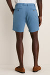 Back view of a person wearing Storm Andrews Flat-Front Short, showcasing classic, effortless style with tailored fit and belt loops, embodying high-end craftsmanship and fun, warm-weather elegance.