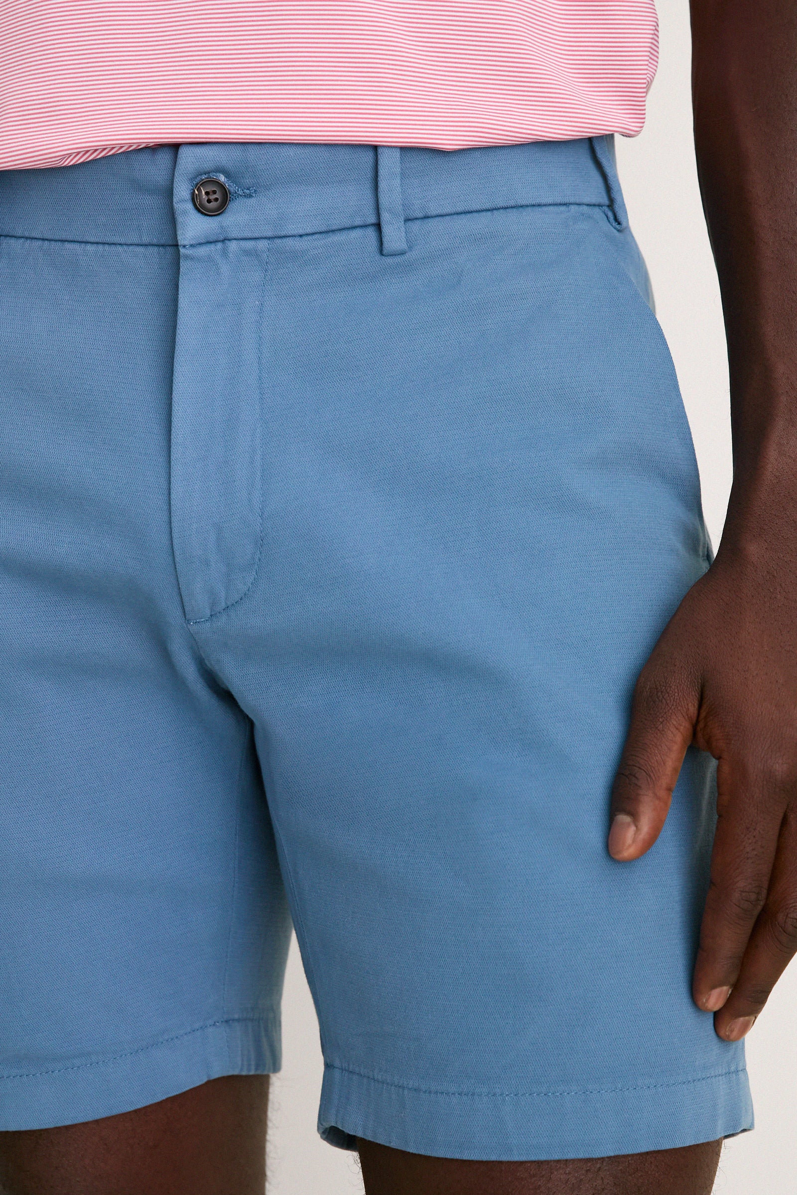 Classic Storm Andrews Flat-Front Short in light blue, showcasing effortless style with a single-button waistband, belt loops, and tailored fit for a fun, high-end look.