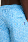 Close-up of Crystal Sea Coronado Swim Trunk with manta-ray pattern, featuring an elastic drawstring waist, side pockets, and a back flap pocket, embodying classic, effortless, high-end style.