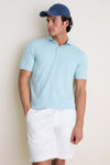 Man wearing the classic Light Willow Ballad Performance Jersey Polo, showcasing its effortless style and tailored fit, perfect for a fun, high-end look.