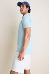 Young man models the classic Light Willow Ballad Performance Jersey Polo, showcasing its effortless, high-end style and technical features, perfect for a fun, casual look.