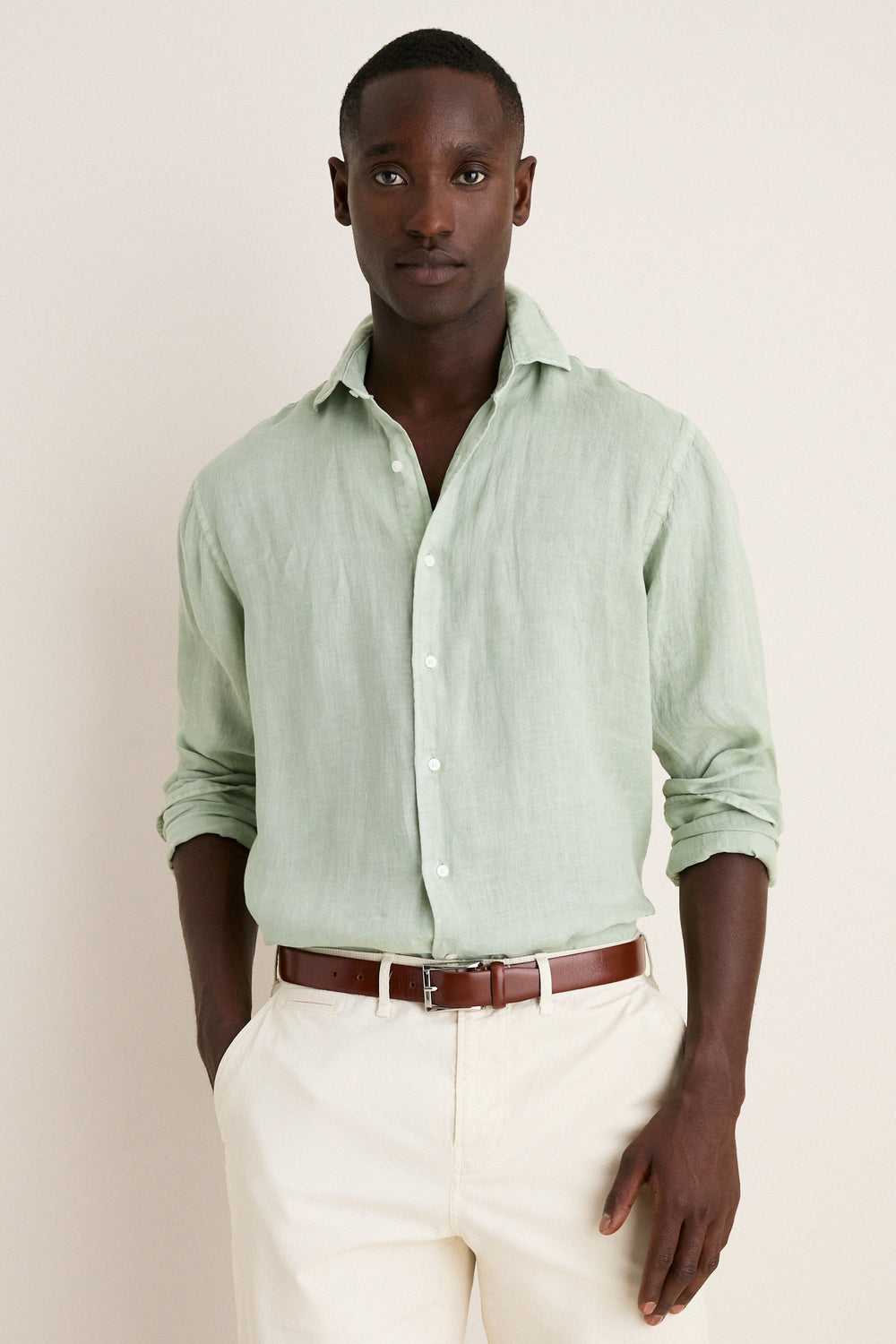 Young Black man models the Grandview Shoreside Linen Sports Shirt, a classic, effortless, high-end button-down, perfect for a fun, confident, and versatile wardrobe.