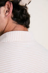 Close-up of the Summer Dunes Stripe Albatross Cotton Blend Pique Polo, highlighting its classic collar texture and effortless style with tonal logo, embodying high-end craftsmanship.