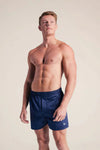 Young man in navy Royal Highnies Boxers (Set of 2), showcasing classic, high-end style with effortless comfort from 100% Pima cotton.