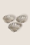 Silver Clam Shell Tidbit Dishes (Set of 3) crafted from recycled aluminum, offer a classic, high-end touch; perfect for effortless, fun entertaining with coastal elegance.