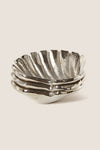 Silver Clam Shell Tidbit Dishes (Set of 3) feature classic, scalloped-edge design; effortlessly fun and high-end for serving appetizers, aligning with Tuckernuck's cool, confident style.