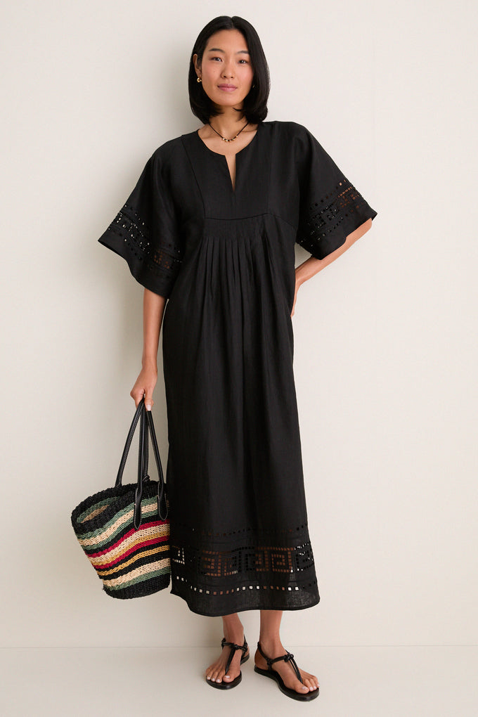 greek style embroidered dress See the gorgeous @theshoelovingstylist in our Elara Dress in an easy breezy  linen in a lovely sky blue.  This beautiful dress designed by Greek  Archaic Kori, features a v-neckline, gathered sweetheart