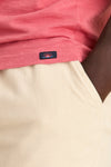 Close-up of a classic Coral Red Sunwashed Pocket Tee, showcasing its relaxed fit and effortless style, perfect for high-end, fun, and easygoing adventures.