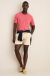Classic Coral Red Sunwashed Pocket Tee effortlessly paired with beige shorts and espadrilles, exuding a fun, high-end, relaxed vibe. Perfect for casual, warm-weather outings.
