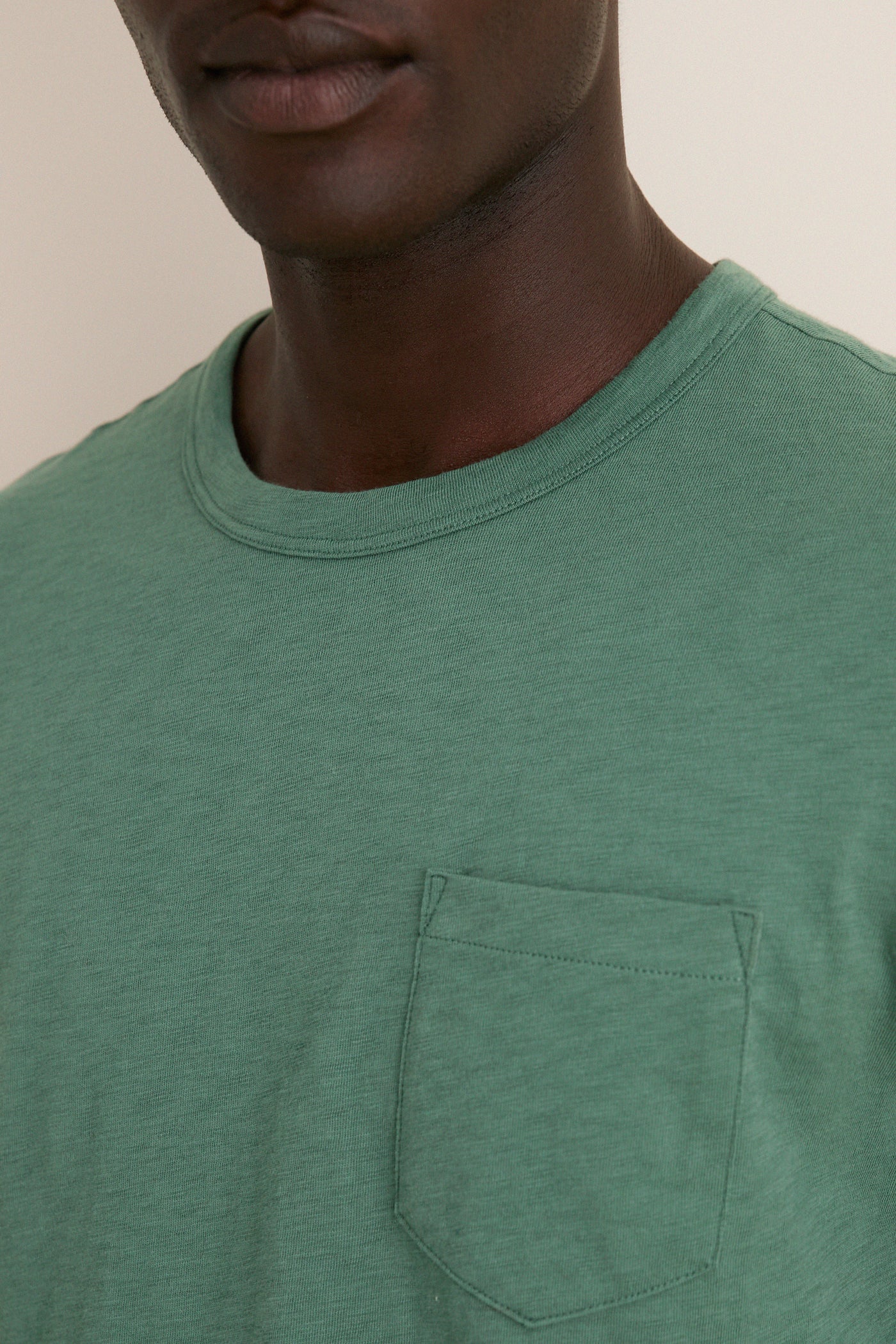 Classic Island Spruce Sunwashed Pocket Tee in soft green, featuring a relaxed fit and chest pocket, exuding effortless style and high-end comfort for everyday fun.