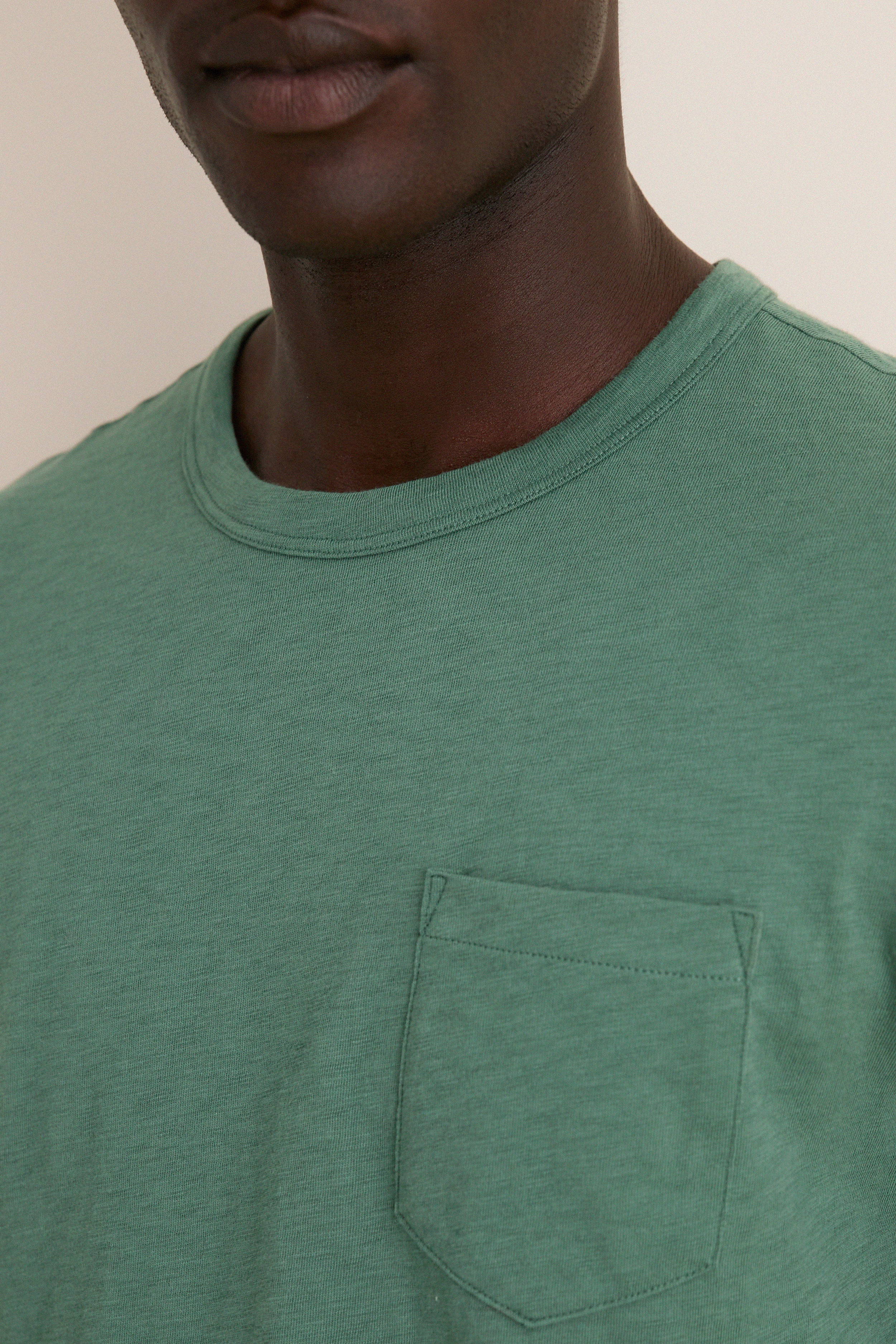 Classic Island Spruce Sunwashed Pocket Tee in soft green, featuring a relaxed fit and chest pocket, exuding effortless style and high-end comfort for everyday fun.