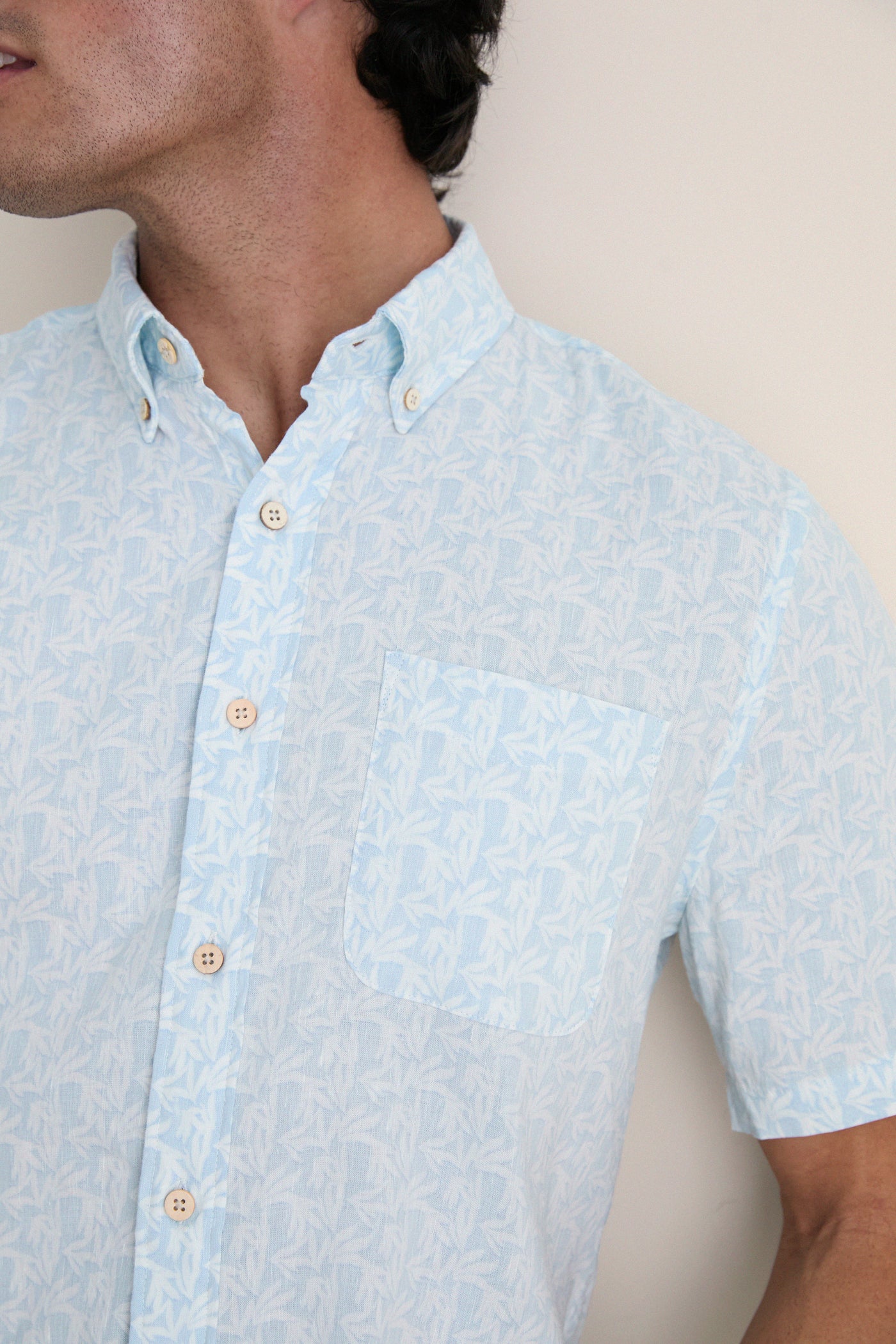 Clear Sky Leaf Breeze Shirt: Effortless, classic short-sleeve shirt with a subtle leaf print, perfect for high-end, fun summer days. Features button placket and chest pocket.