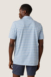 Person wearing the classic Bermuda Sail Stripe Sunwashed Tee Shirt Polo with thin stripes, exuding an effortless, high-end style against a neutral background, embodying Tuckernuck's fun shopping experience.