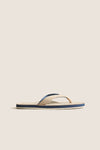 Classic Sand Pier Pebbled Leather Sandal with beige straps, navy and cream striped sole, offering effortless style and high-end comfort for fun, relaxed outings.