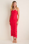 Woman models the Cherry Red Philomena Midi Dress, featuring a classic strapless design and raised floral-lace pattern, paired with gold accessories for an effortless, high-end look.