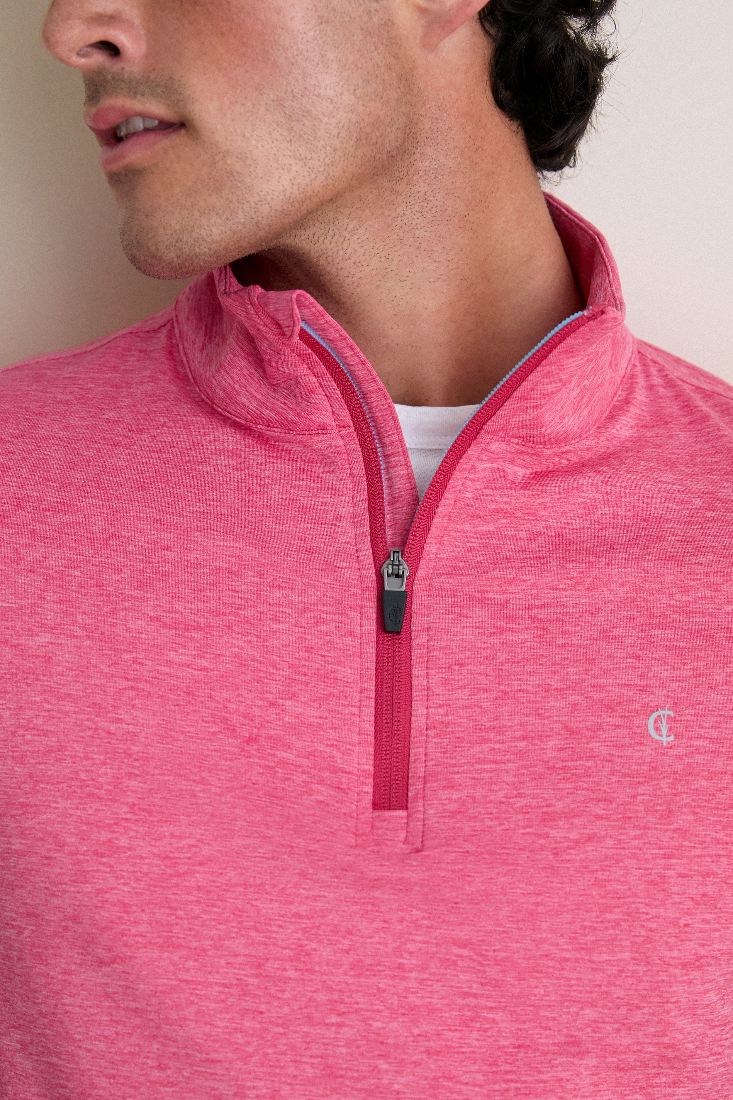Man wearing Heathered Red Featherweight Performance Pullover, showcasing its classic quarter-zip design and effortless style, ideal for high-end, fun outings.