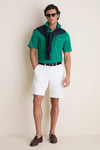 Man models the Home Turf Performance Sport Players Shirt, a classic polo with a 4-button placket, exuding an effortless and high-end summer-casual style.