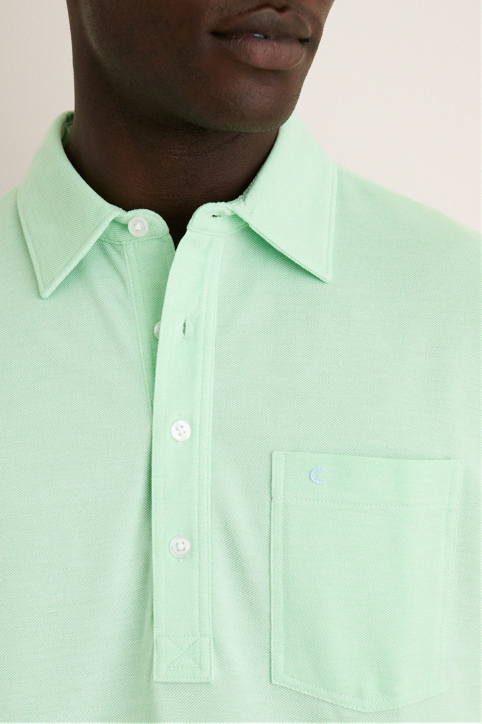 Classic Key West Oxford Pique Players Shirt with textured piqué fabric, fold-over collar, three-button placket, and embroidered “C” logo on the chest pocket. Effortlessly high-end style.
