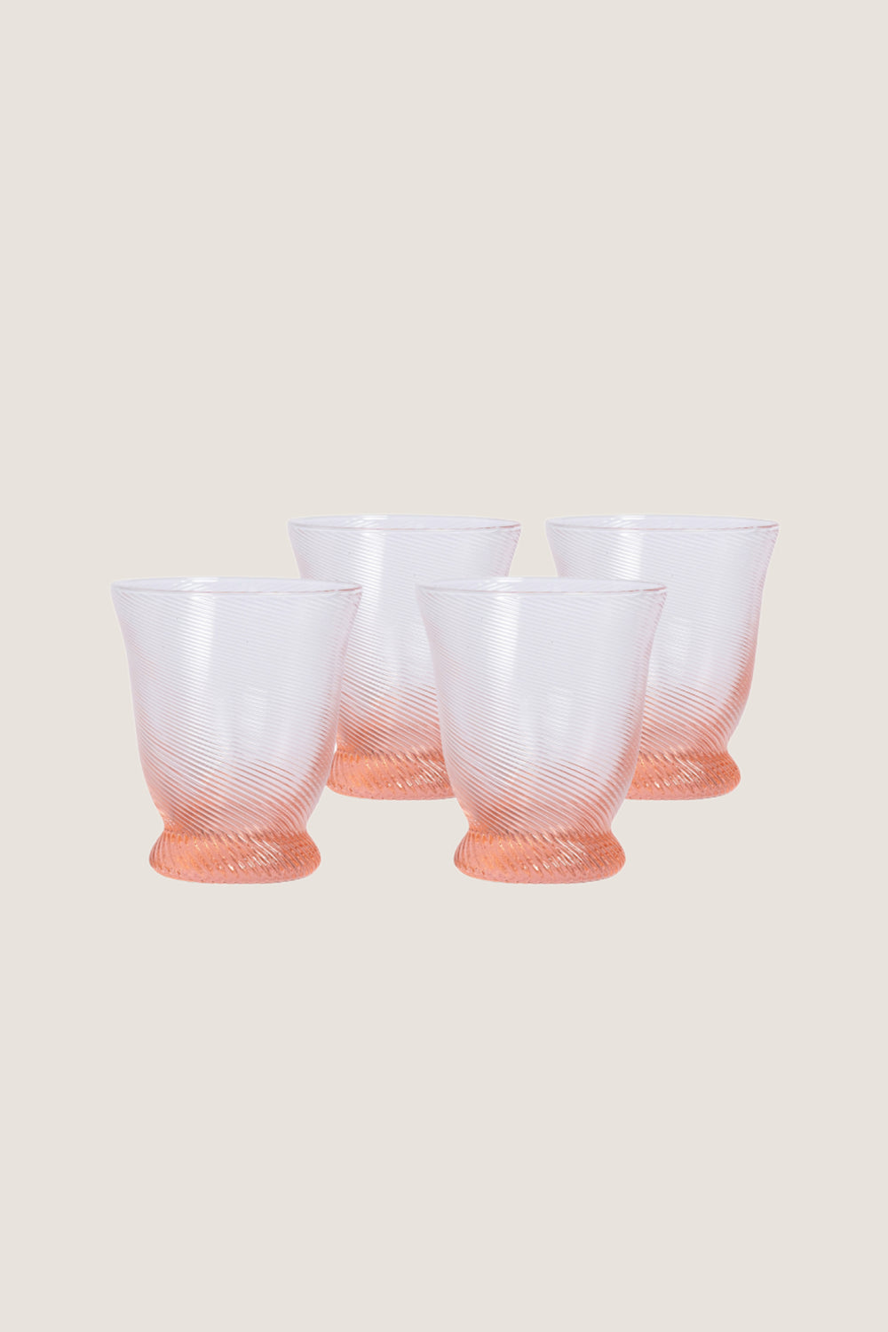Peony Pink Spiral Tumbler (Set of 4), featuring classic rib-patterned, swirled texture with a flared silhouette, offers an effortless, high-end touch to any fun tablescape.
